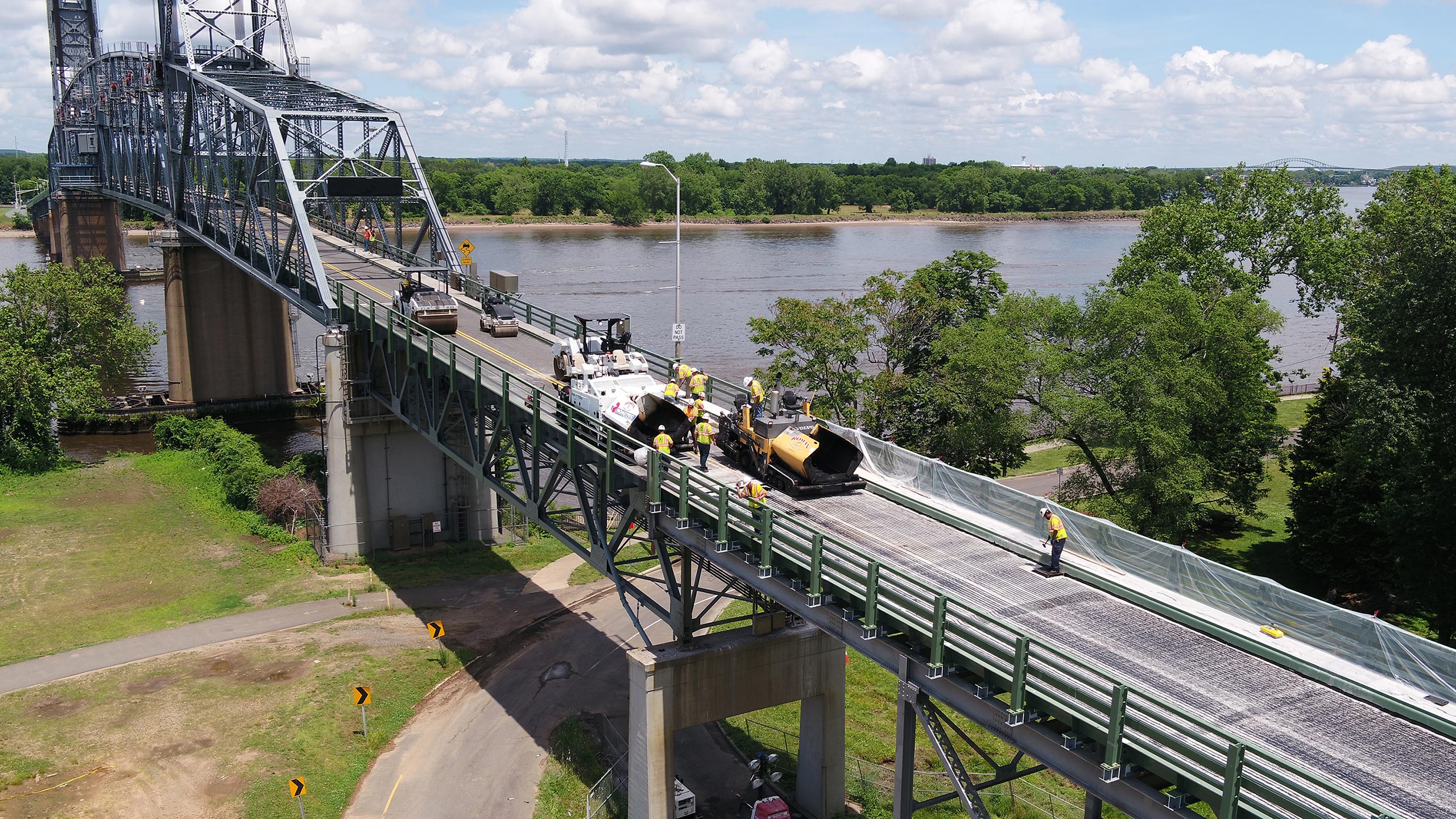 Construction workers working on replacing a span of the Burlington-Bristol Bridge