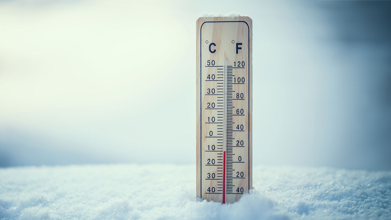 Thermometer sitting in snow