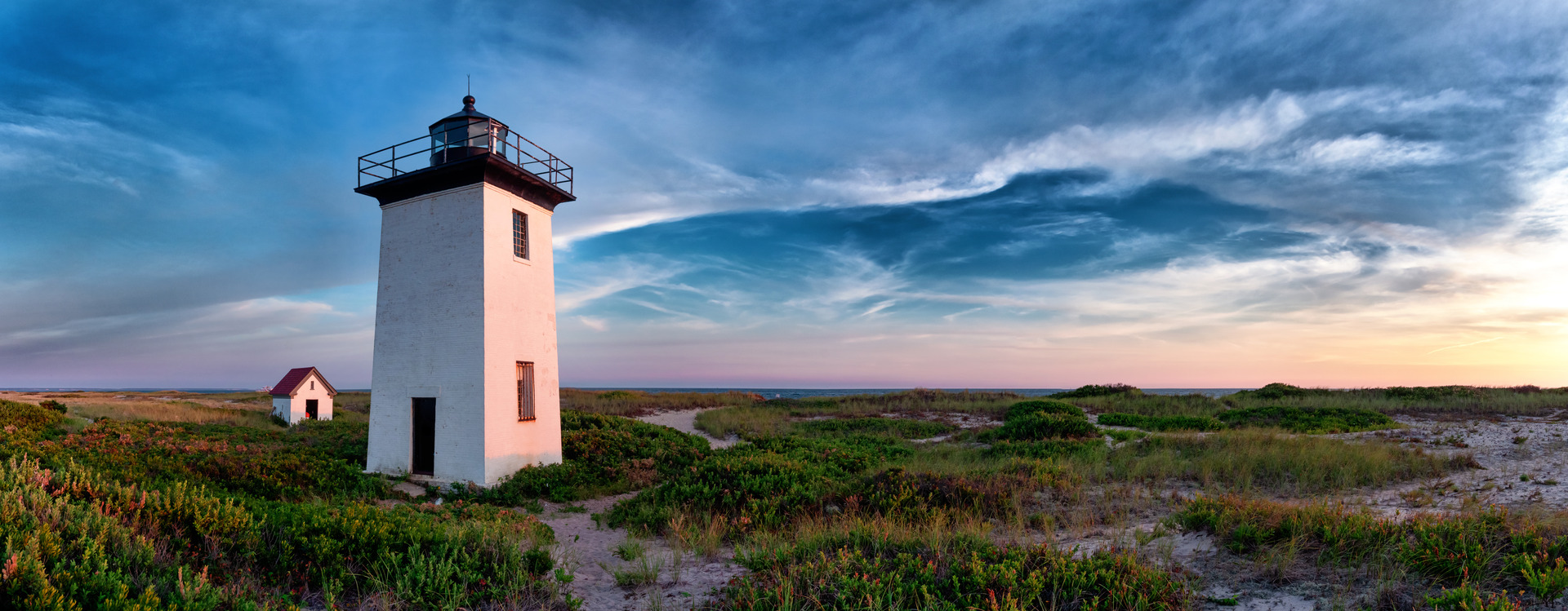 Wood End lighthouse during sunset in Provincetown, Massachusetts, USA. Panoramoc view