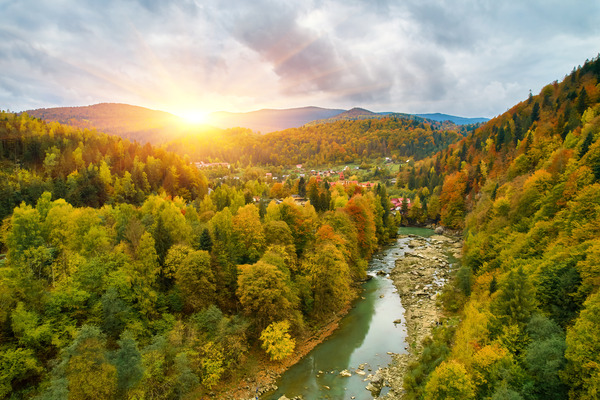 aerial bird's-eye view of colorful forest, blue river and rocks. Drone shot. natural beautiful autumn landscape